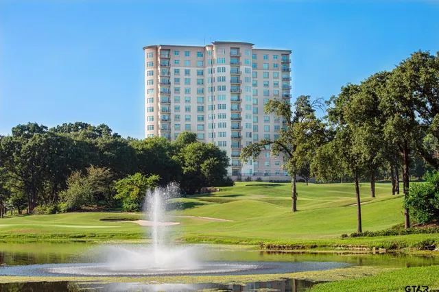 a view of a large building with a yard