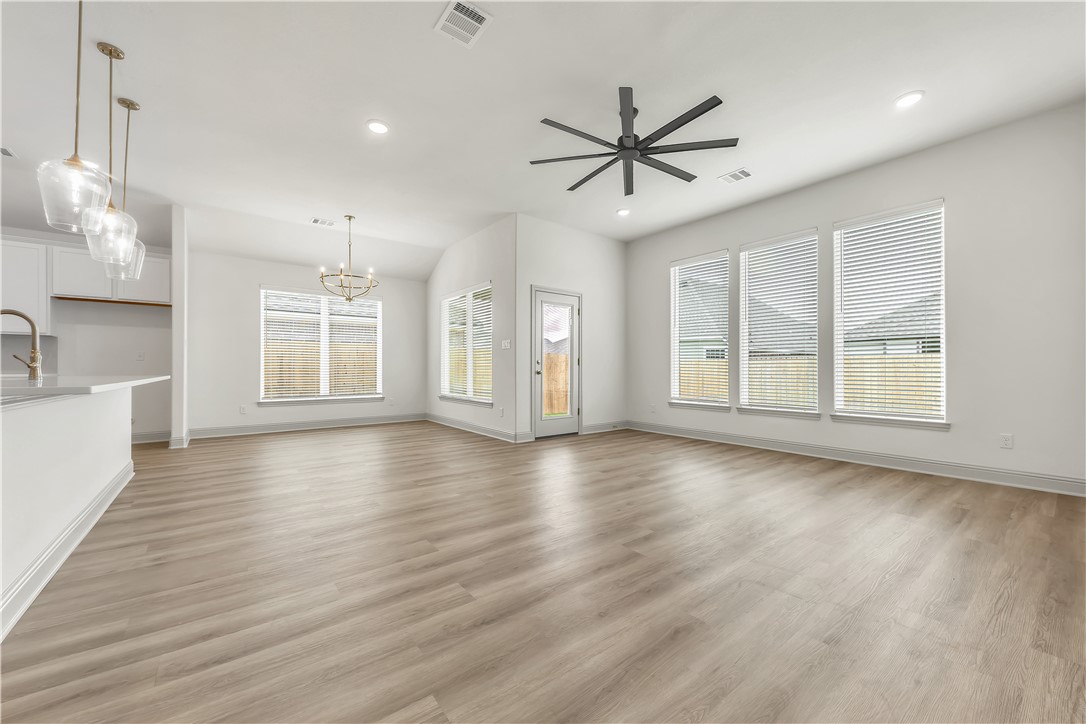 5955 Eldora Drive College Station, TX 77845 - Photo 13 of 36 a view of an empty room with a window and wooden floor
