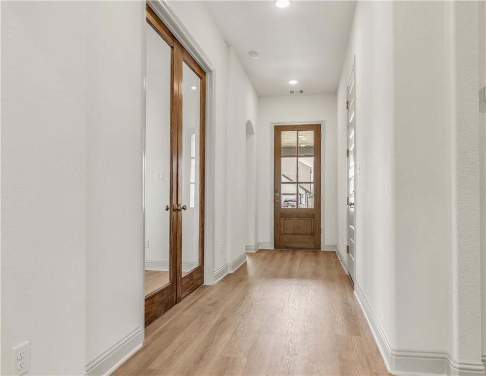 5955 Eldora Drive College Station, TX 77845 - Photo 2 of 36 a view of a hallway with wooden floor and closet