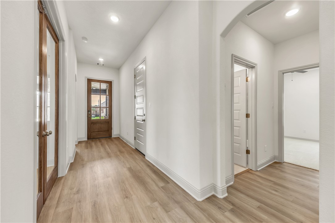 5955 Eldora Drive College Station, TX 77845 - Photo 25 of 36 wooden floor with a chandelier