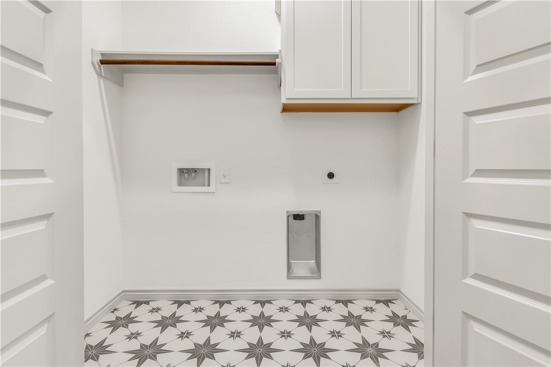 5955 Eldora Drive College Station, TX 77845 - Photo 28 of 36 a view of a utility room with wooden floor