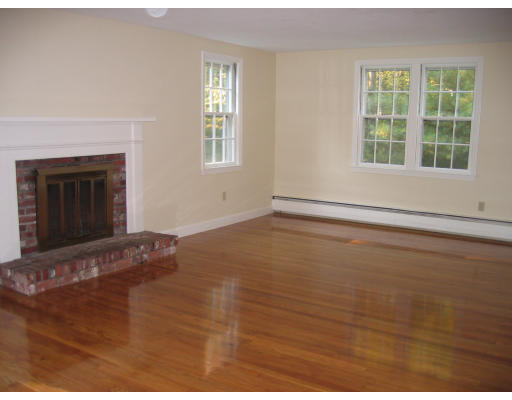 23 Forrest Road Topsfield, MA 01983 - Photo 3 of 20 a view of an empty room with a window and wooden floor