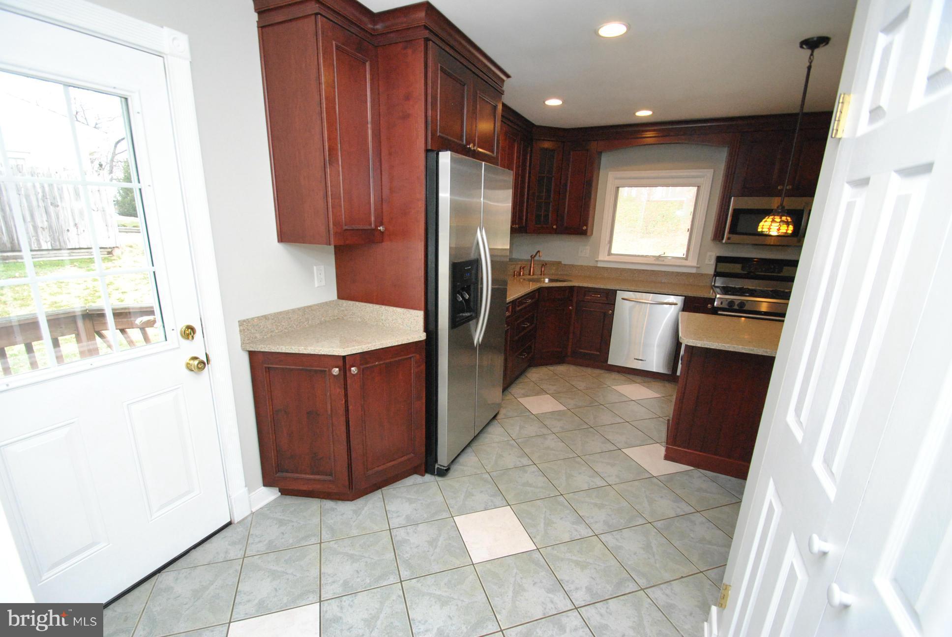 4713 Ballygar Road Nottingham, MD 21236 - Photo 7 of 30 CHEF'S DREAM KITCHEN WITH 2 CUSTOM SINKS & ISLAND