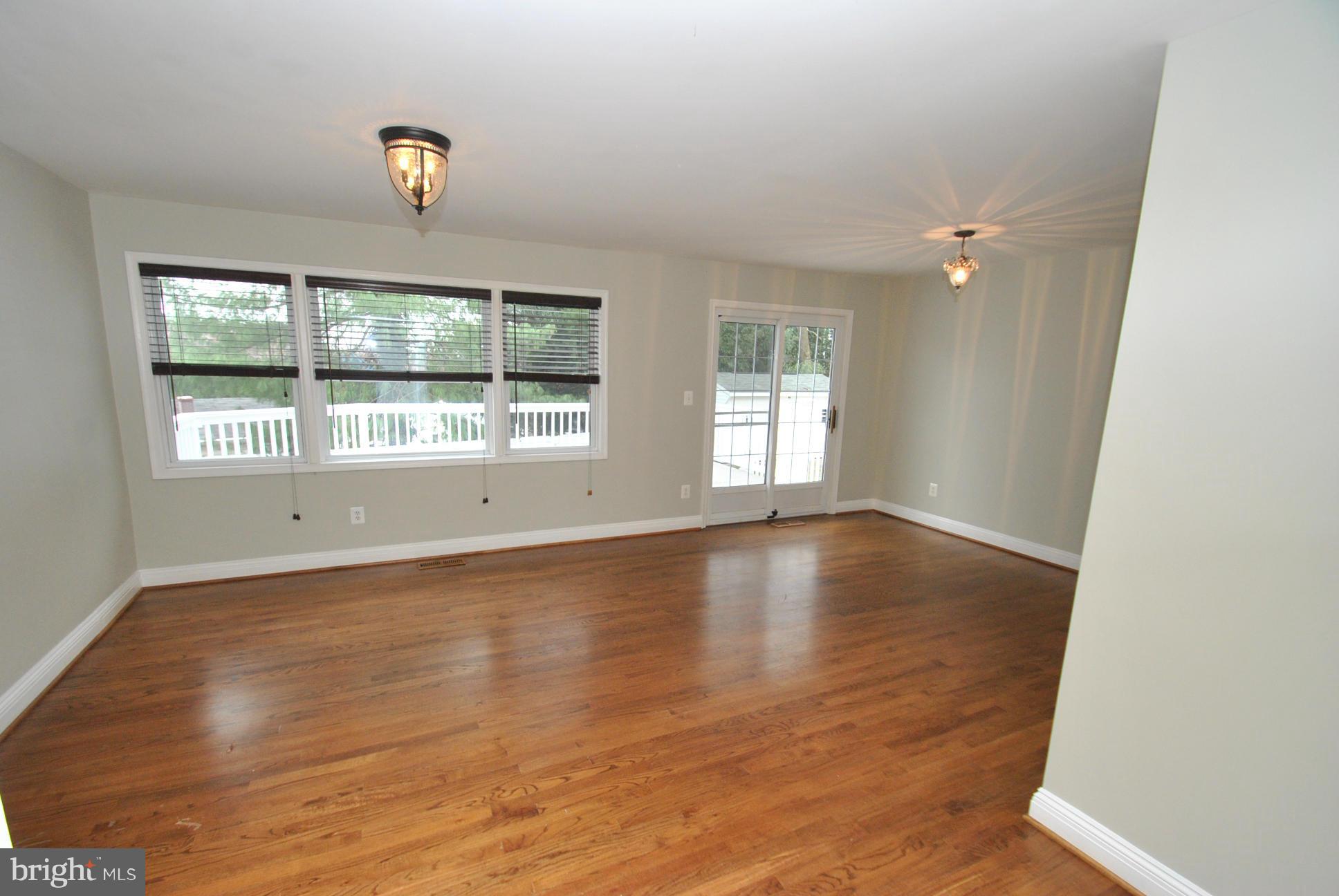 4713 Ballygar Road Nottingham, MD 21236 - Photo 8 of 30 GLEAMING NATURAL HARDWOOD FLOORING & FRESH PAINT