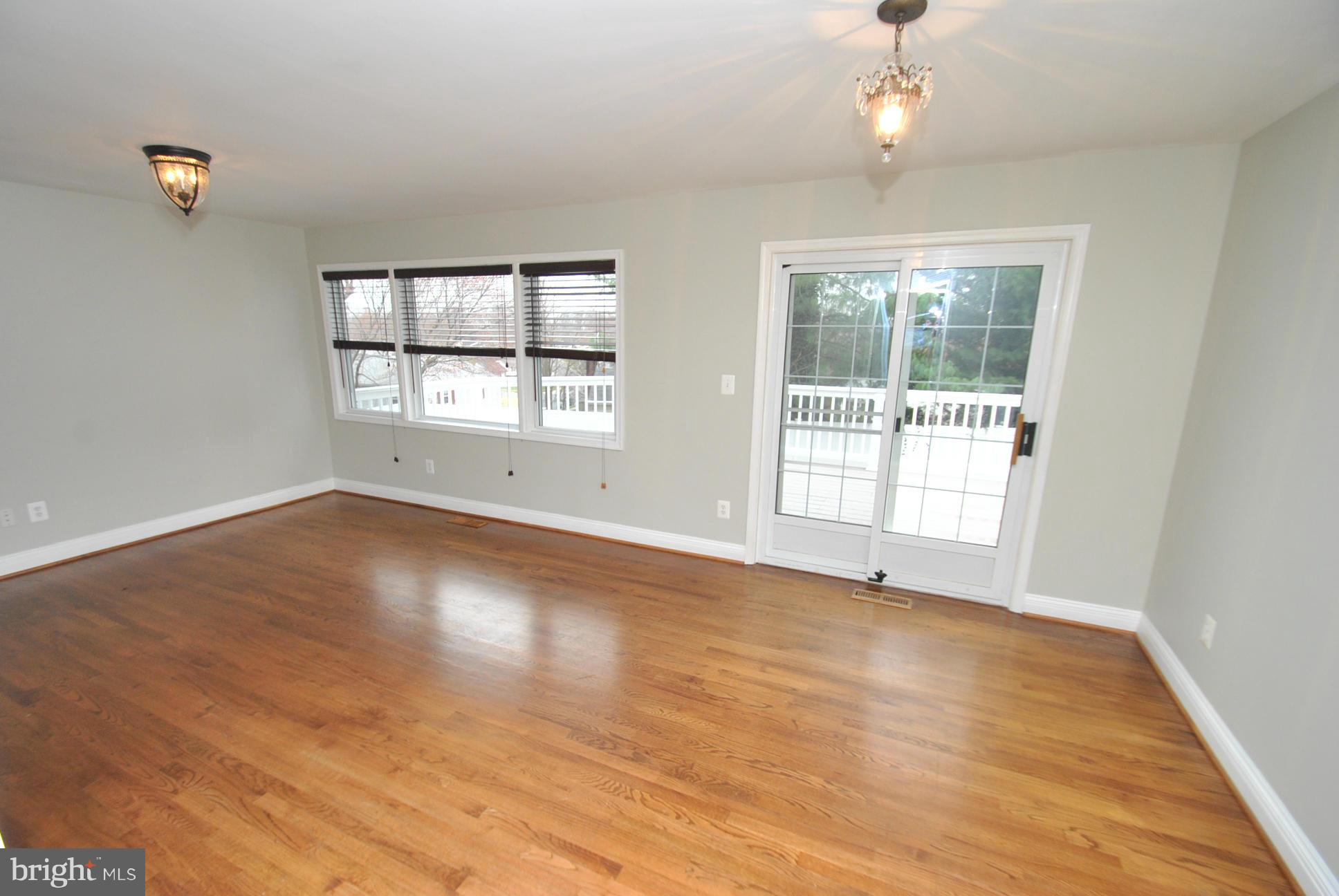 4713 Ballygar Road Nottingham, MD 21236 - Photo 9 of 30 GLEAMING NATURAL HARDWOOD FLOORING & FRESH PAINT