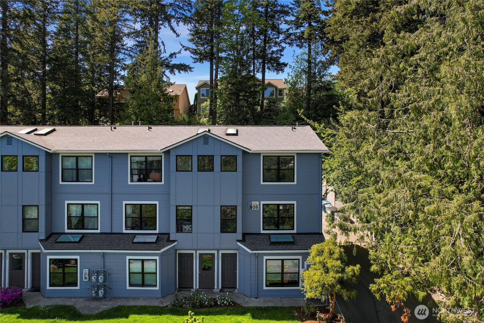 808 20th, Unit 208 Bellingham, WA 98225 - Photo 23 of 28 a front view of a residential apartment building with yard and parking space