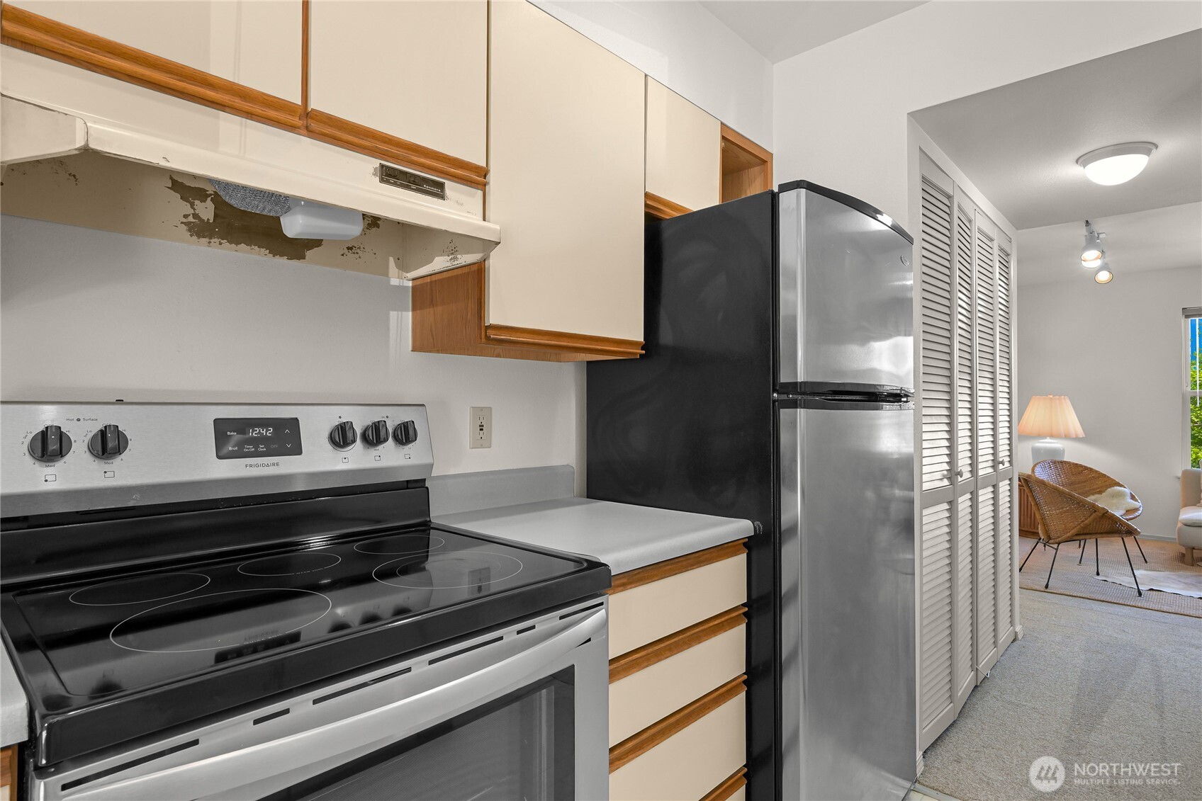 808 20th, Unit 208 Bellingham, WA 98225 - Photo 9 of 28 a kitchen with stainless steel appliances granite countertop a refrigerator and a stove
