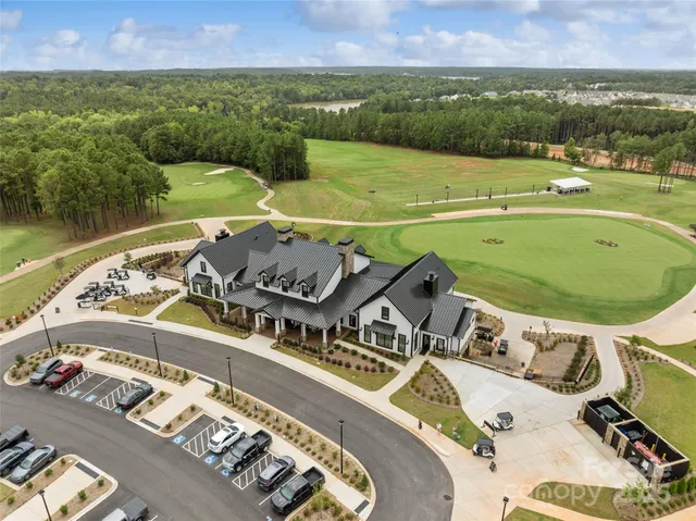 a view of a house with patio and garden
