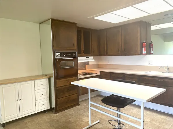 a kitchen with a table and chairs