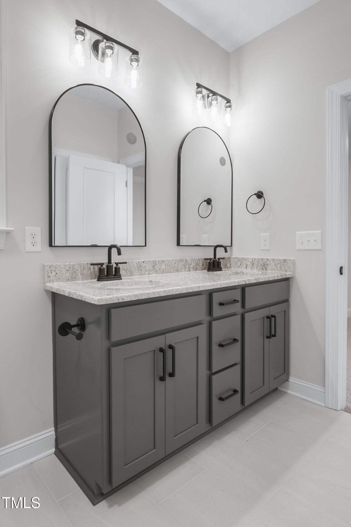 4948 Zebulon Road Zebulon, NC 27597 - Photo 19 of 35 a bathroom with a granite countertop double vanity sink and a mirror