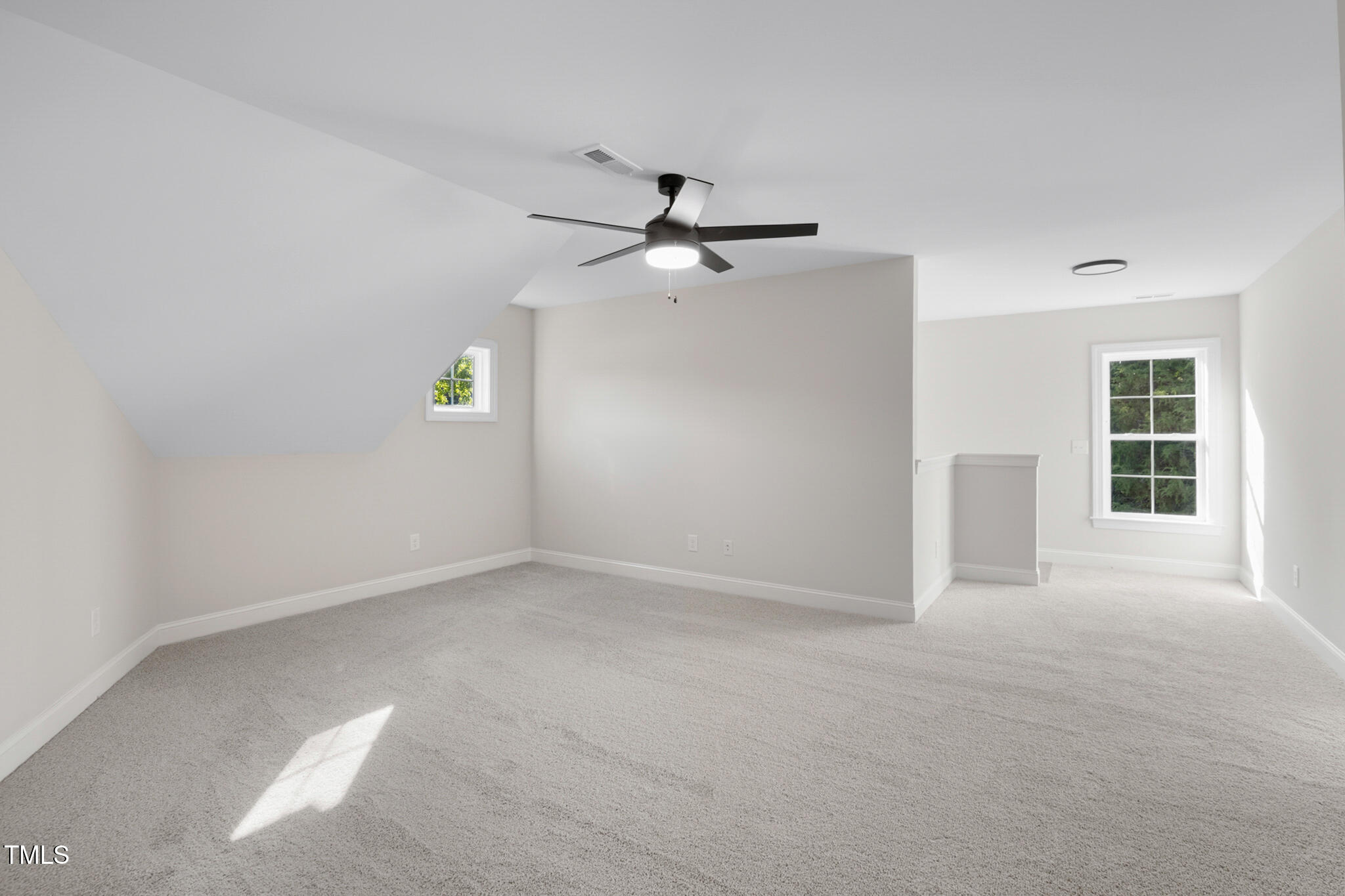 4948 Zebulon Road Zebulon, NC 27597 - Photo 20 of 35 an empty room with windows and fan
