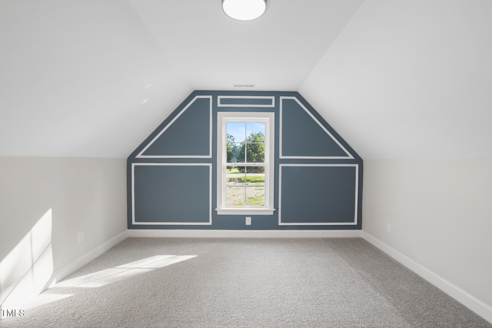 4948 Zebulon Road Zebulon, NC 27597 - Photo 27 of 35 a view of an empty room with a window