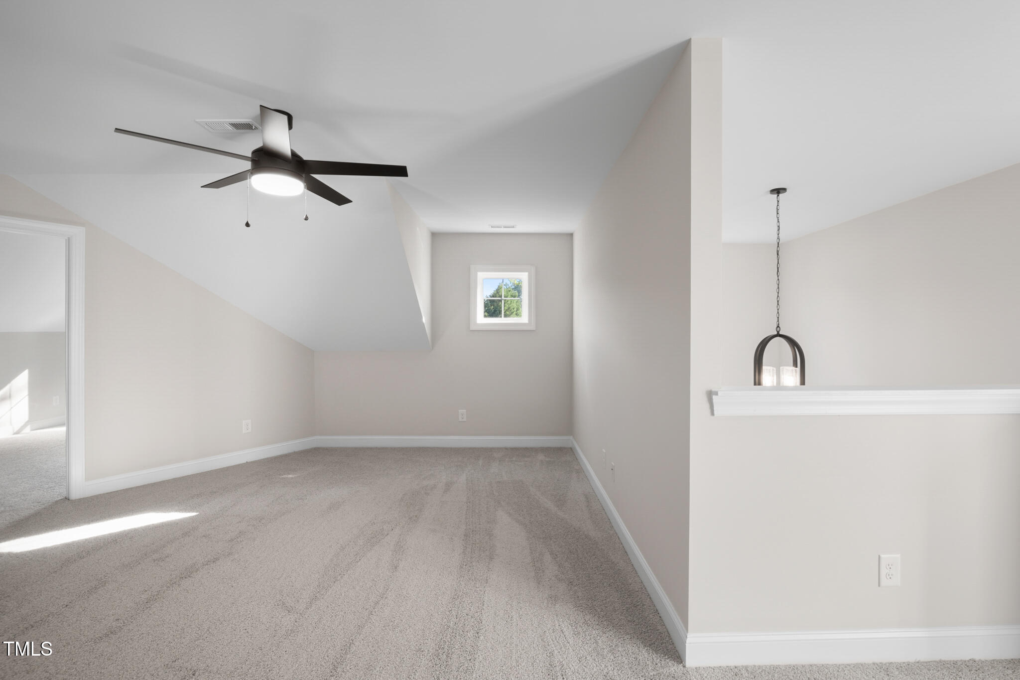 4948 Zebulon Road Zebulon, NC 27597 - Photo 29 of 35 a view of a room with wooden floor and a ceiling fan