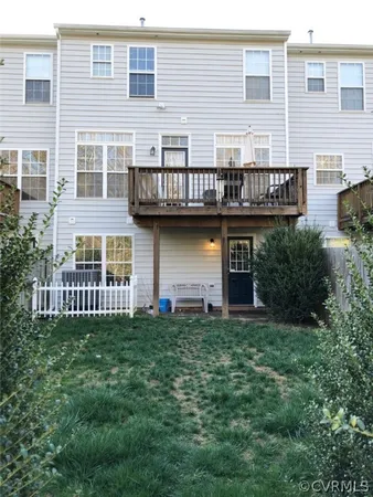 a view of a house with a yard and sitting space