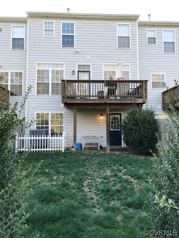 a view of a house with a yard and sitting space
