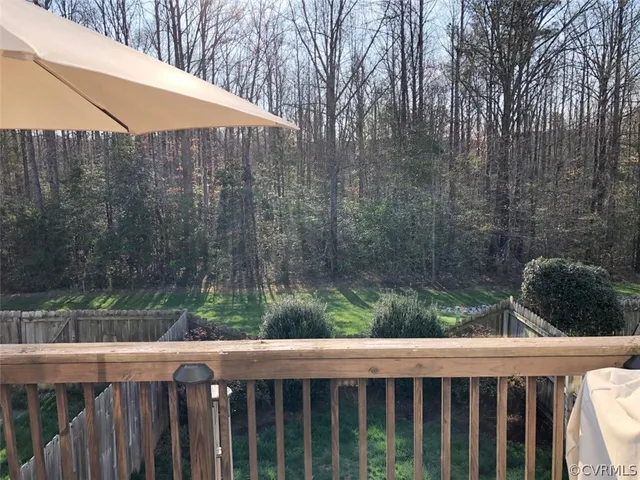 a view of wooden fence and trees