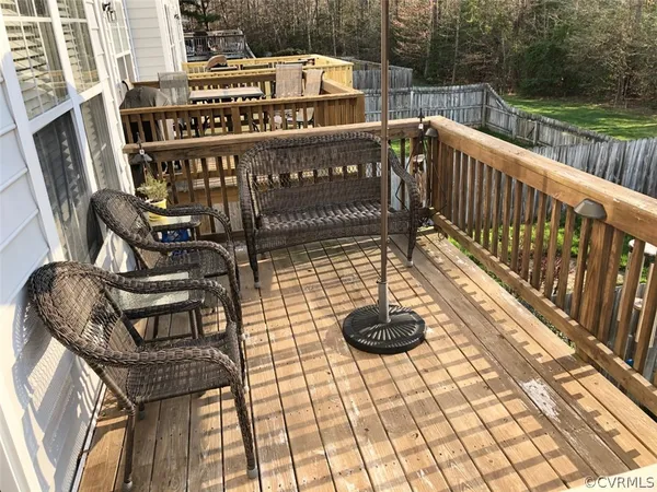 a view of a chairs and tables on the roof deck