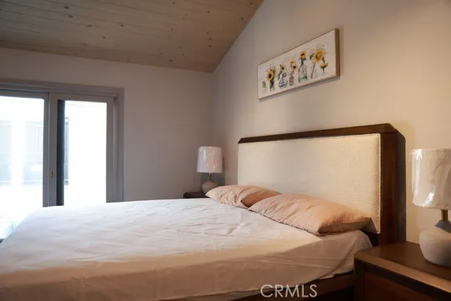 a bathroom with a granite countertop sink a toilet and a mirror