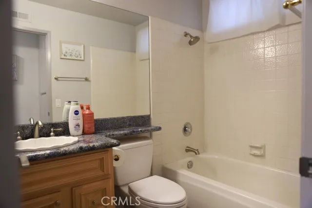 a bedroom with a bed and wall painting