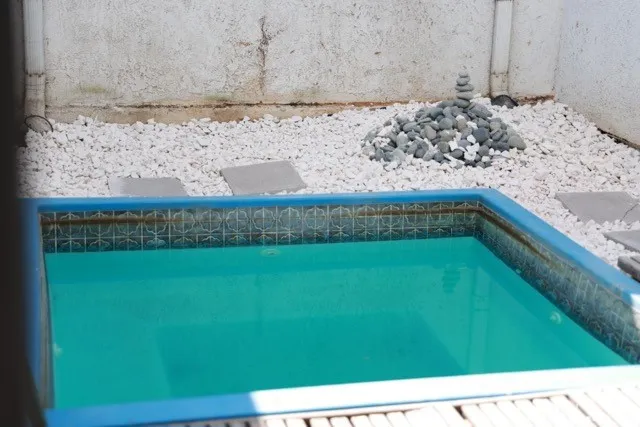 a vase of flowers sitting on a floor
