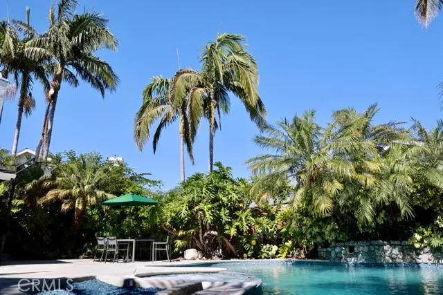 a backyard of a house with outdoor seating