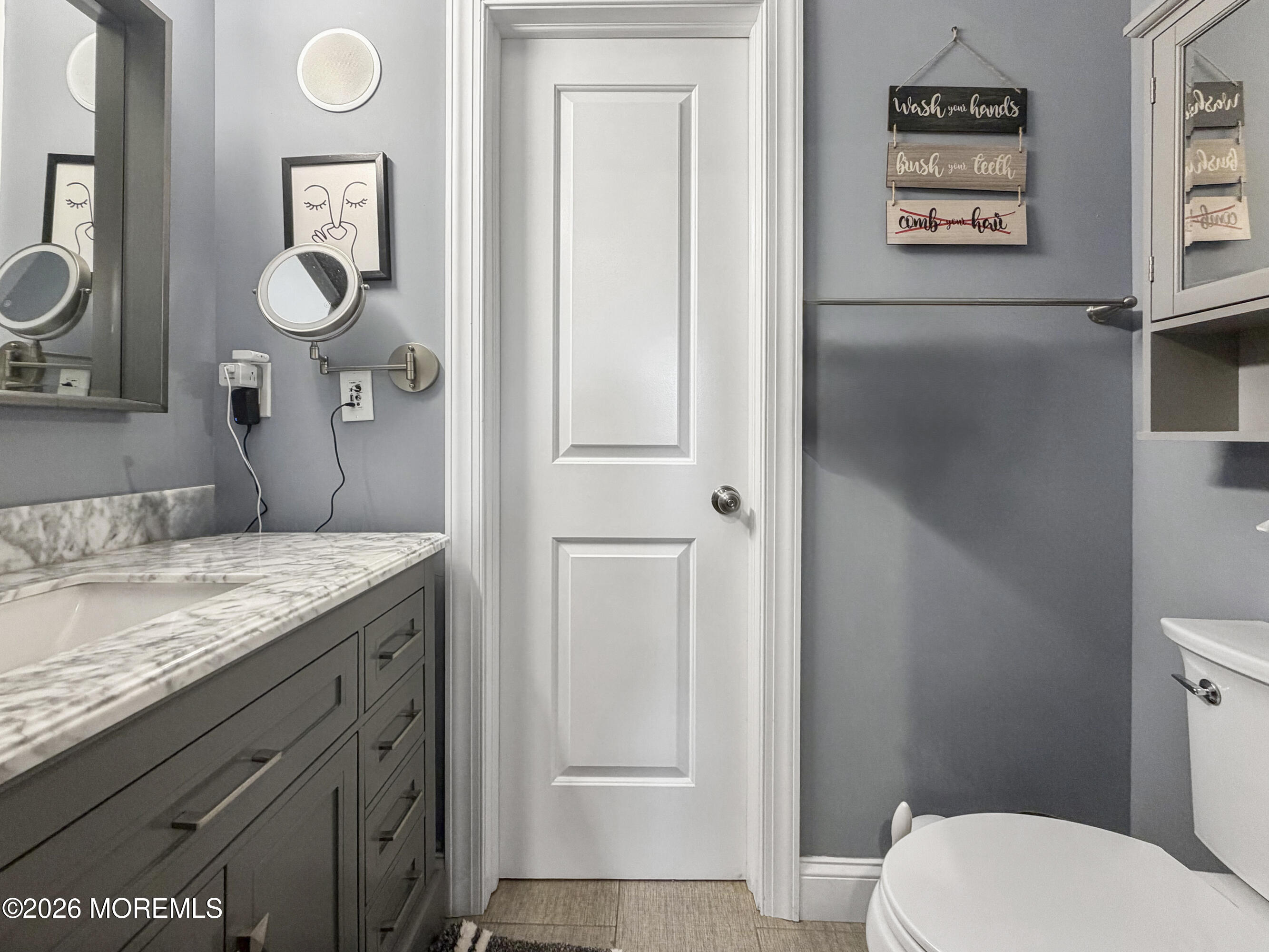 191 Summit Avenue Middletown, NJ 07718 - Photo 11 of 38 a bathroom with a granite countertop sink mirror vanity and toilet