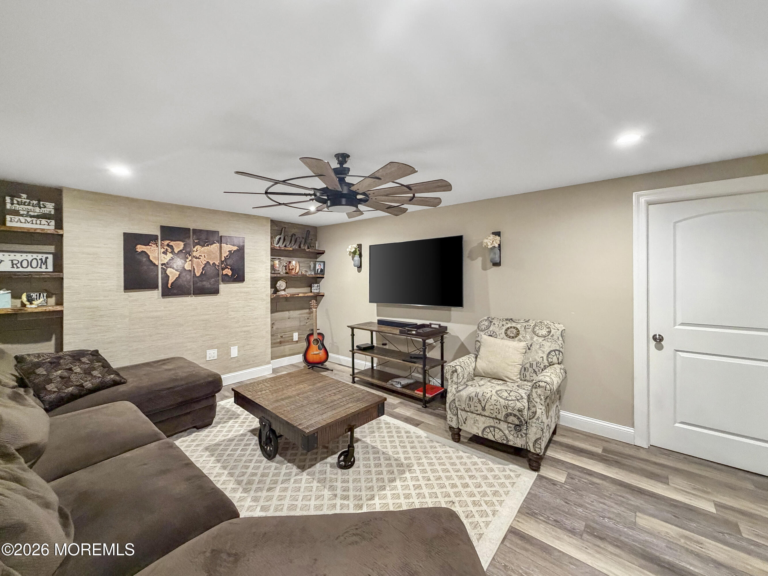 191 Summit Avenue Middletown, NJ 07718 - Photo 27 of 38 a living room with furniture and a flat screen tv