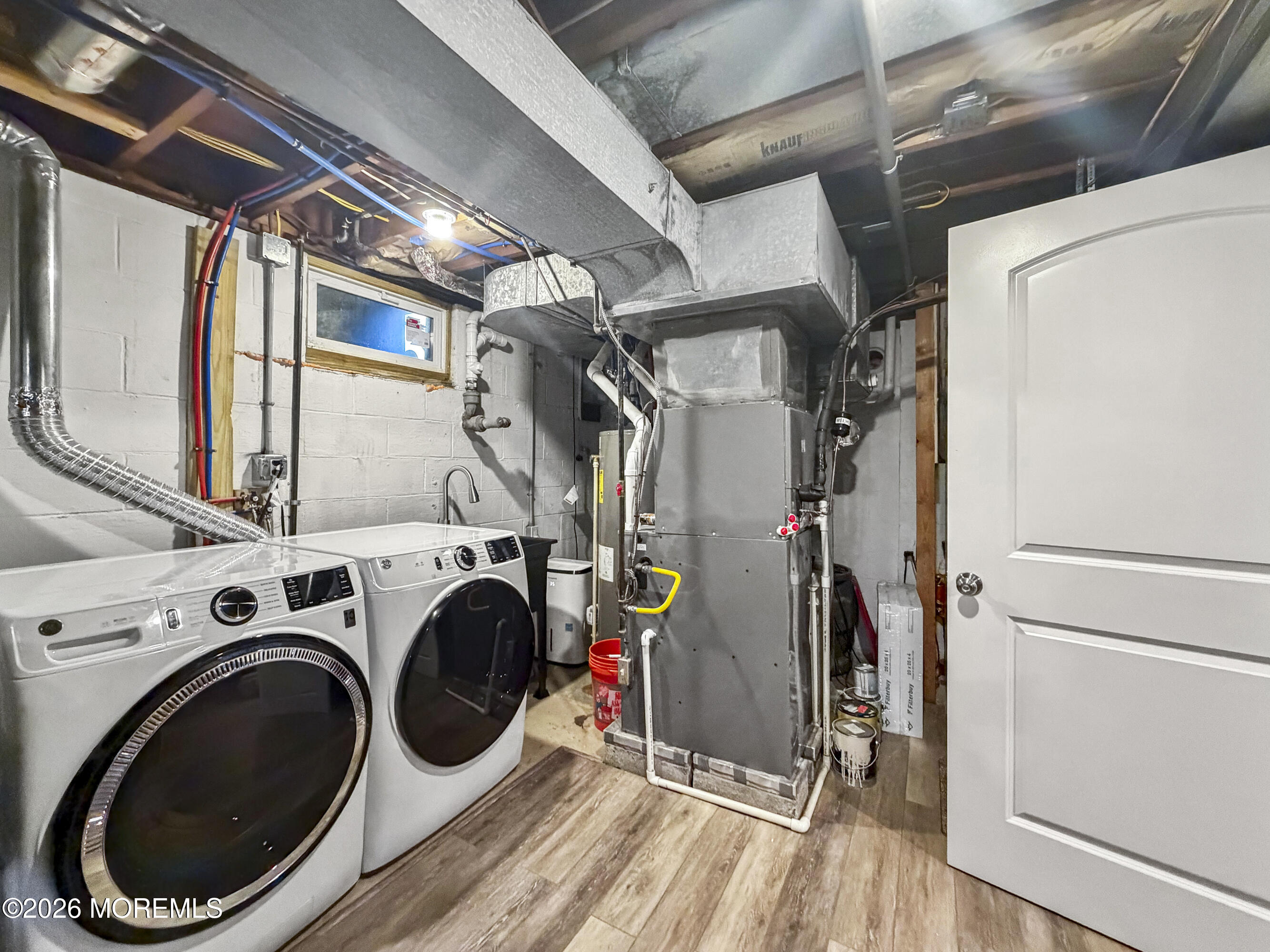 191 Summit Avenue Middletown, NJ 07718 - Photo 28 of 38 a view of storage and utility room with washer and dryer
