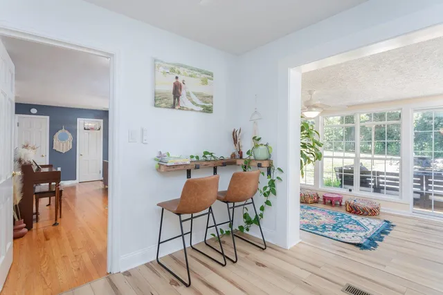 a bedroom with furniture and a window