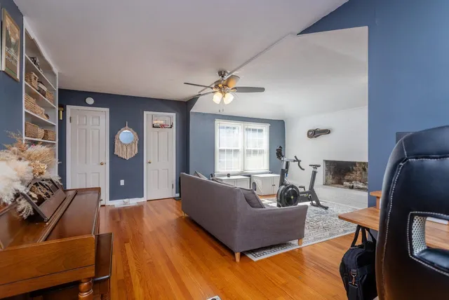 a bedroom with furniture and a wooden floor
