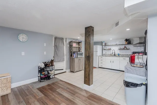 an aerial view of a houses with a city view