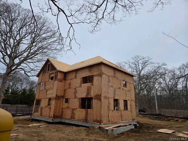 a front view of a house with large windows