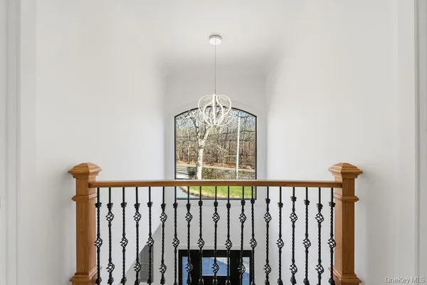 a view of a hallway with windows