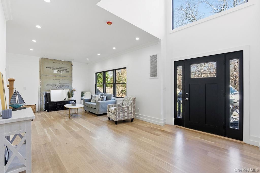 768 Bridgehampton Sag Harbor Westhampton Beach, NY 11978 - Photo 34 of 35 a view of a livingroom with furniture and windows