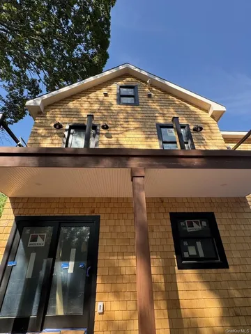 a front view of a building with glass windows