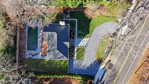 an aerial view of a house with a garden