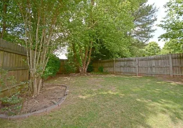 a view of a backyard with a trees