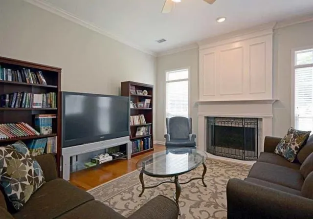 a living room with furniture and a fireplace