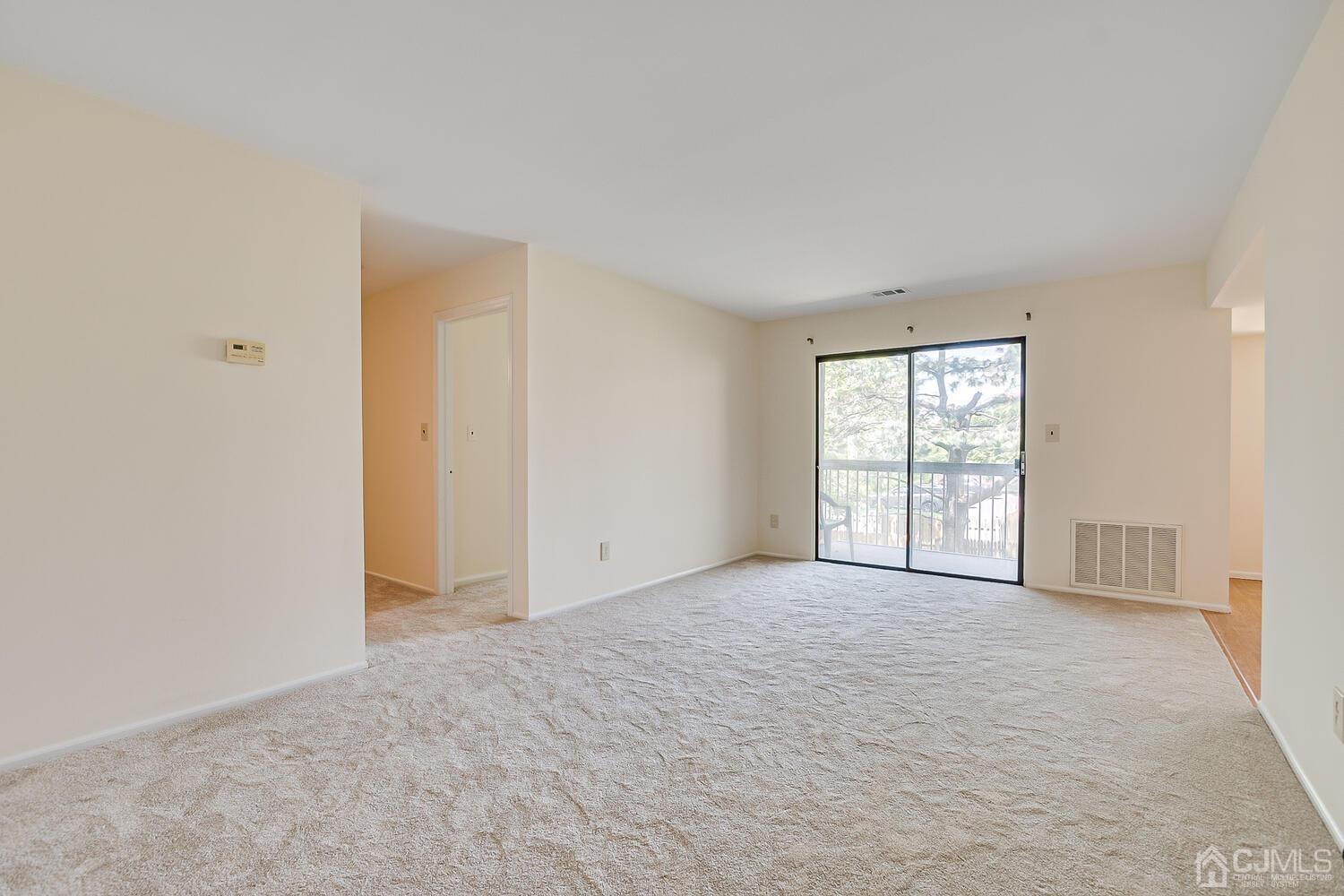 116 Keystone Court, Unit 1162 Woodbridge, NJ 07095 - Photo 16 of 28 an empty room with windows and closet