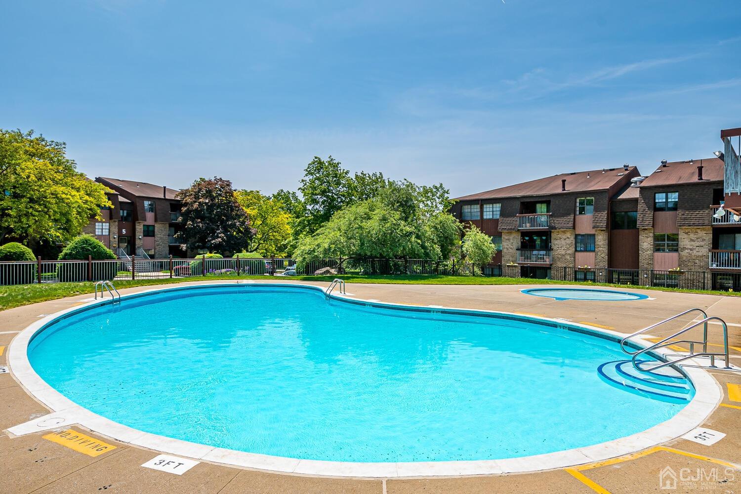 116 Keystone Court, Unit 1162 Woodbridge, NJ 07095 - Photo 26 of 28 a view of outdoor space yard swimming pool and patio