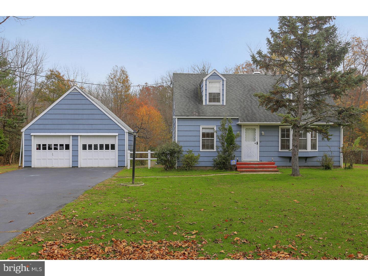 871 Mt Lucas Road Princeton, NJ 08540 - Photo 1 of 25 a front view of a house with a garden and trees