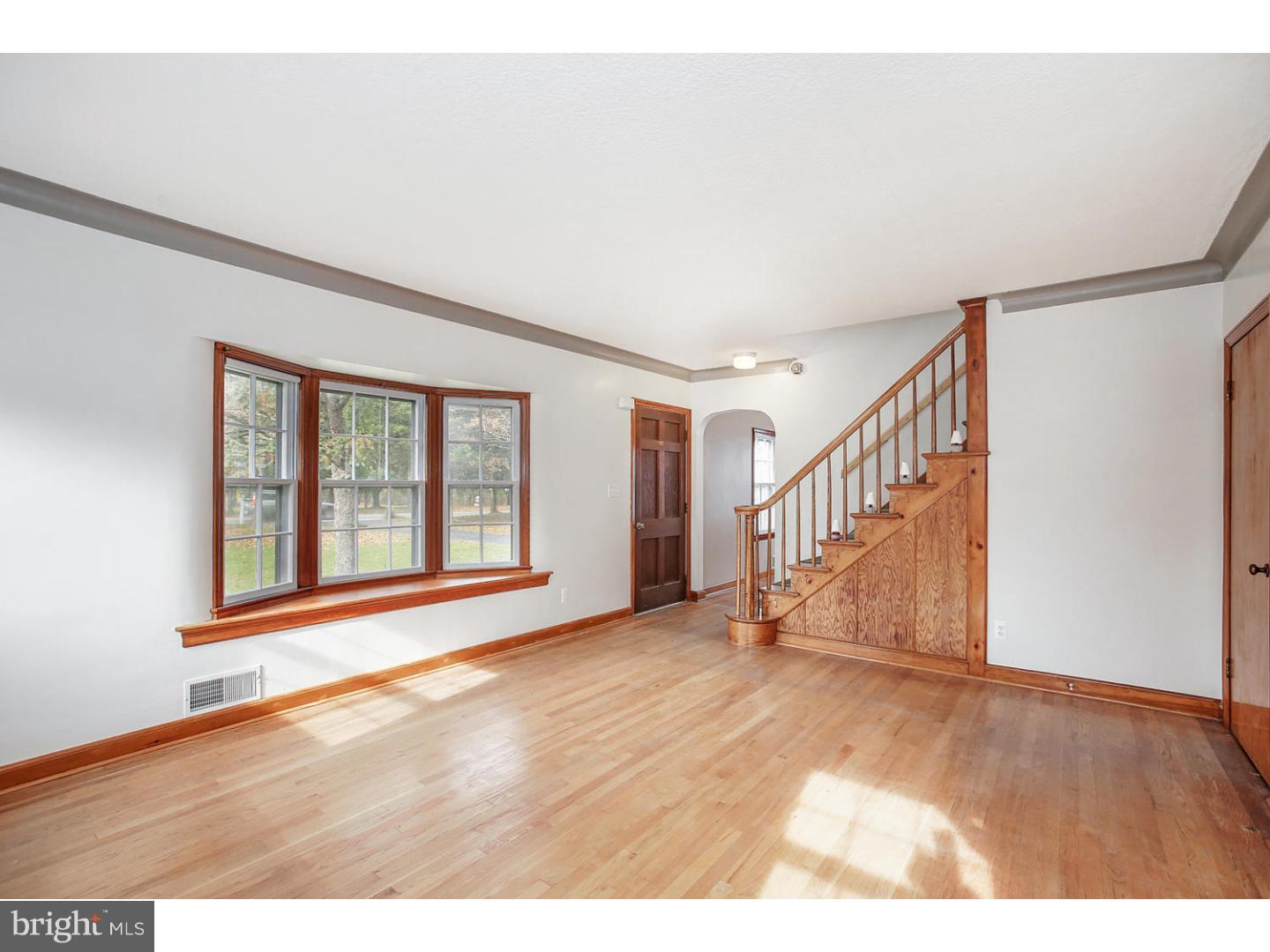 871 Mt Lucas Road Princeton, NJ 08540 - Photo 5 of 25 a view of an empty room with wooden floor and stairs