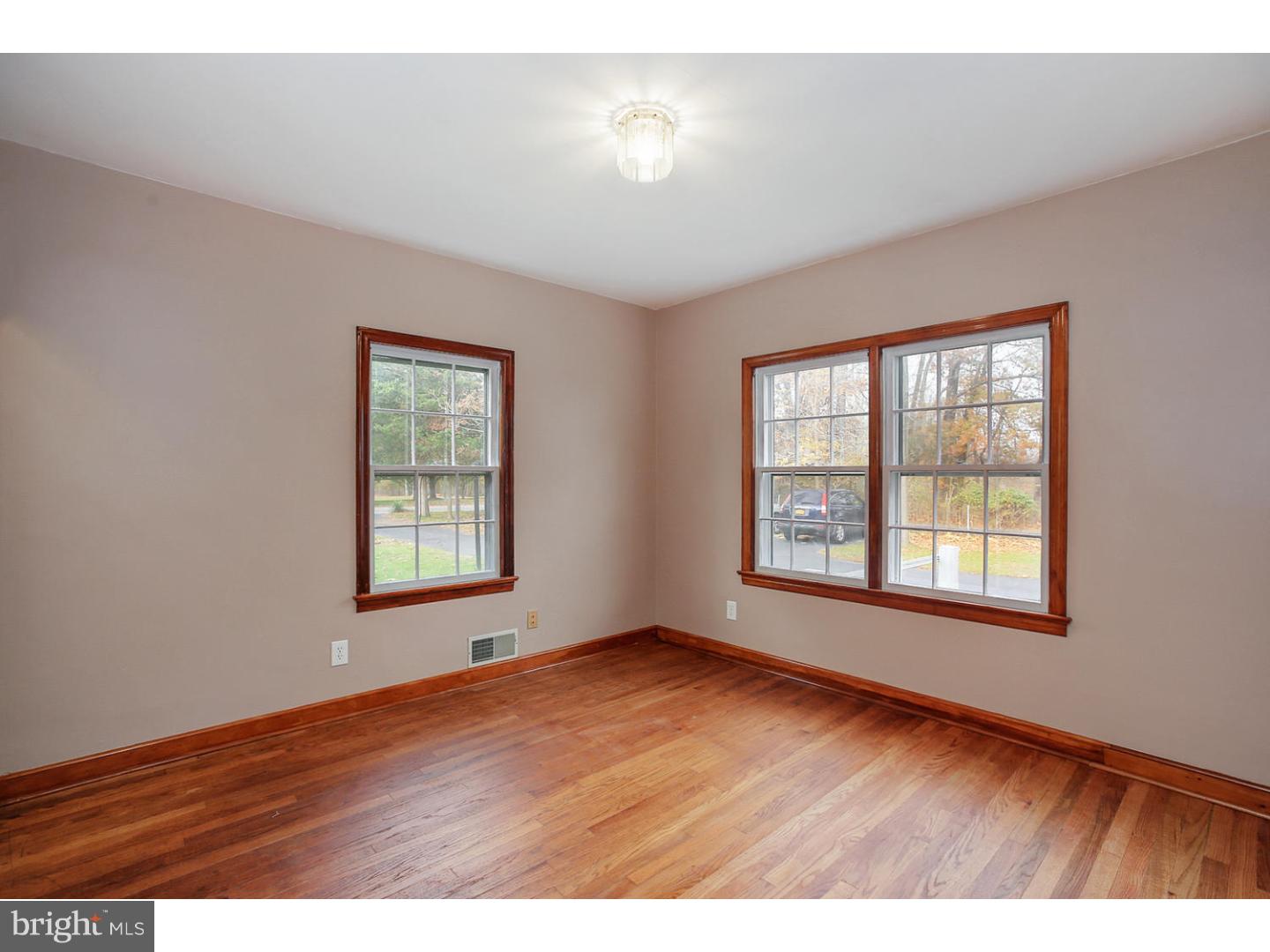 871 Mt Lucas Road Princeton, NJ 08540 - Photo 7 of 25 a view of an empty room with a window and wooden floor
