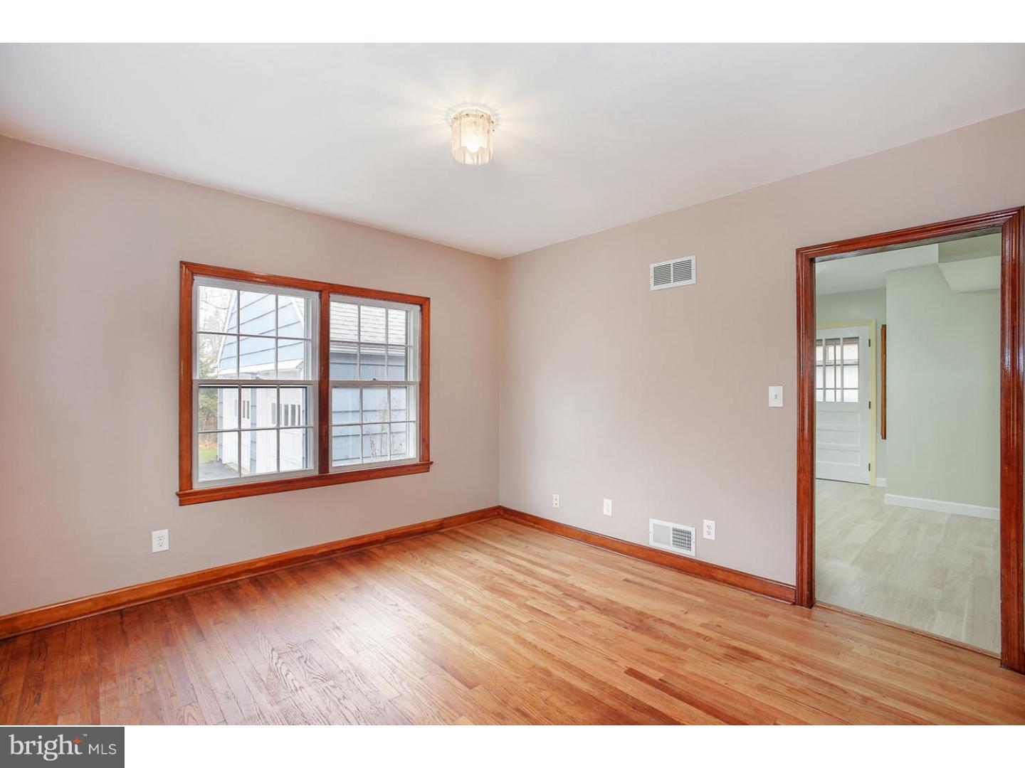 871 Mt Lucas Road Princeton, NJ 08540 - Photo 8 of 25 an empty room with wooden floor and windows