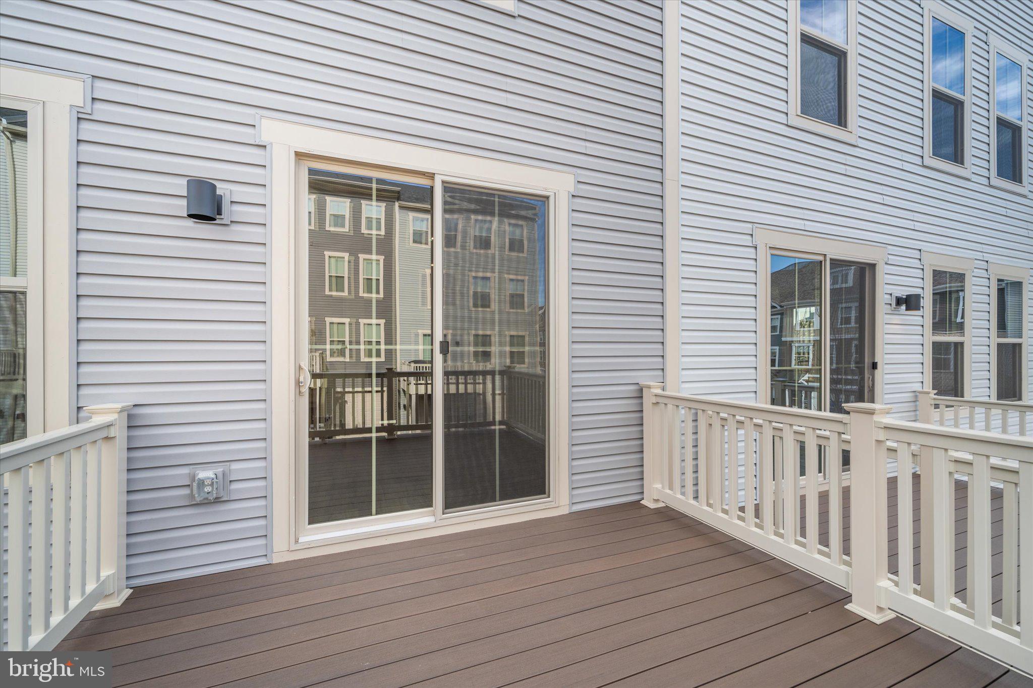 42530 Invergordon Terrace Sterling, VA 20166 - Photo 11 of 39 a view of a house with wooden deck