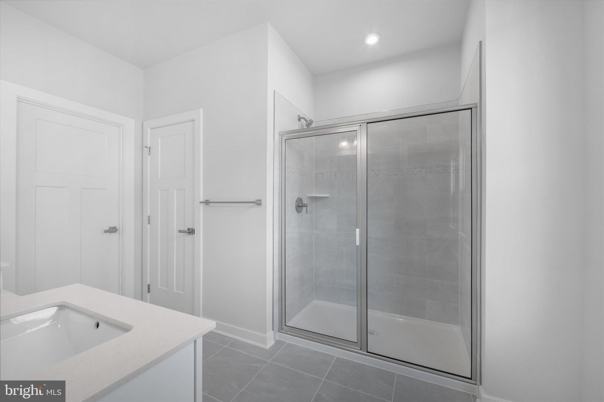42530 Invergordon Terrace Sterling, VA 20166 - Photo 17 of 39 a bathroom with a shower and toilet