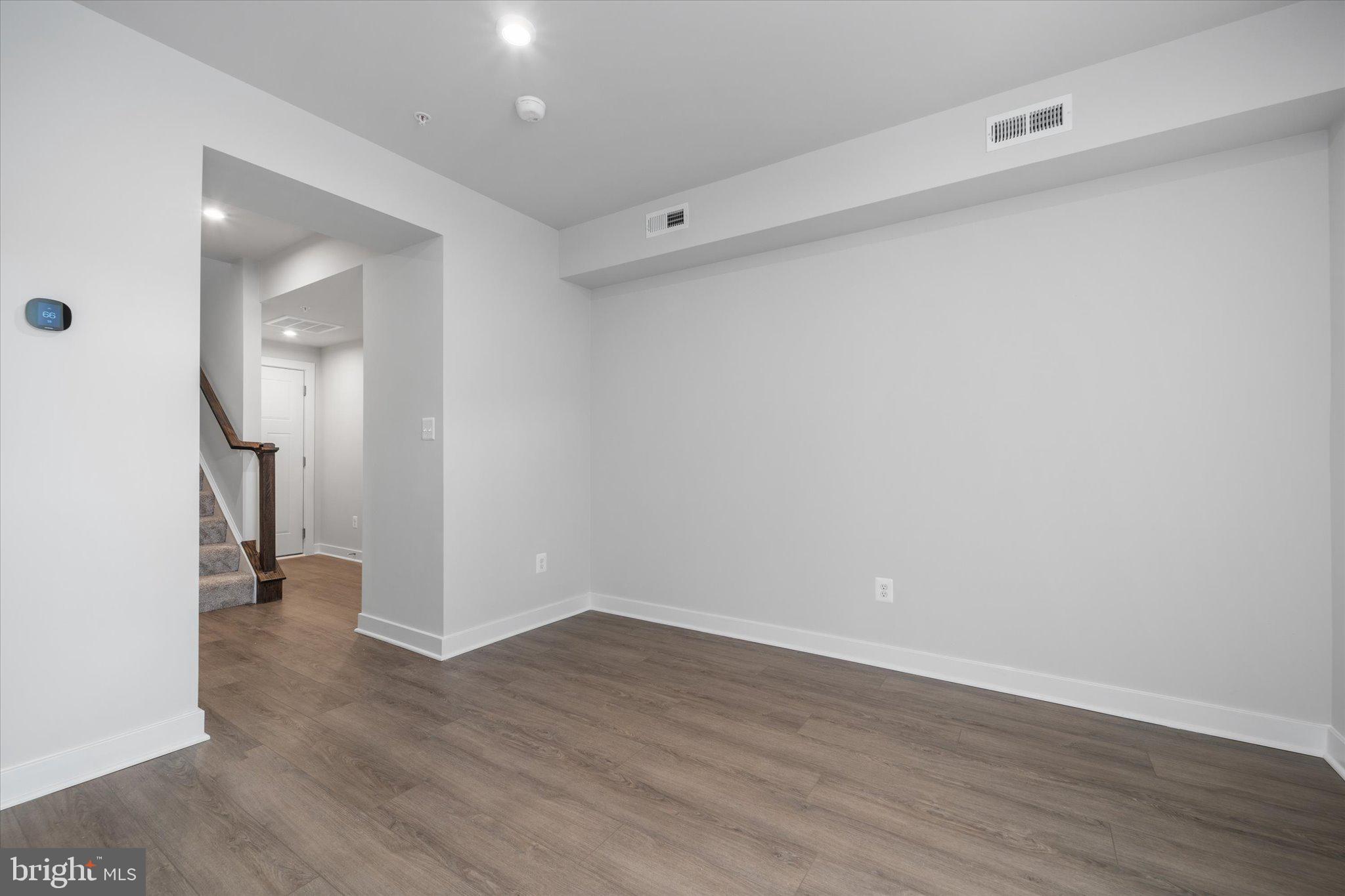 42530 Invergordon Terrace Sterling, VA 20166 - Photo 21 of 39 a view of a room with wooden floor