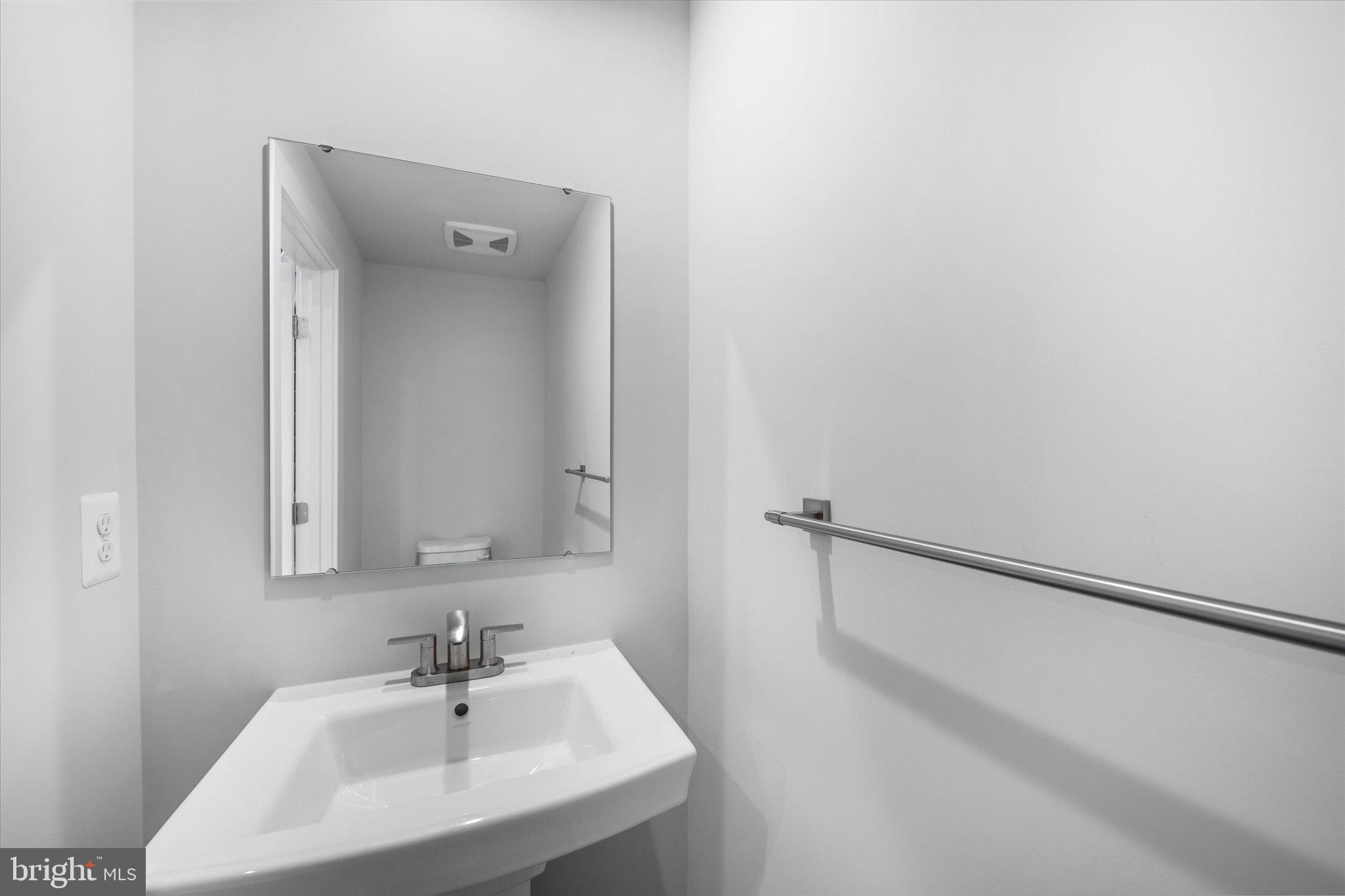 42530 Invergordon Terrace Sterling, VA 20166 - Photo 23 of 39 a bathroom with a sink and a mirror
