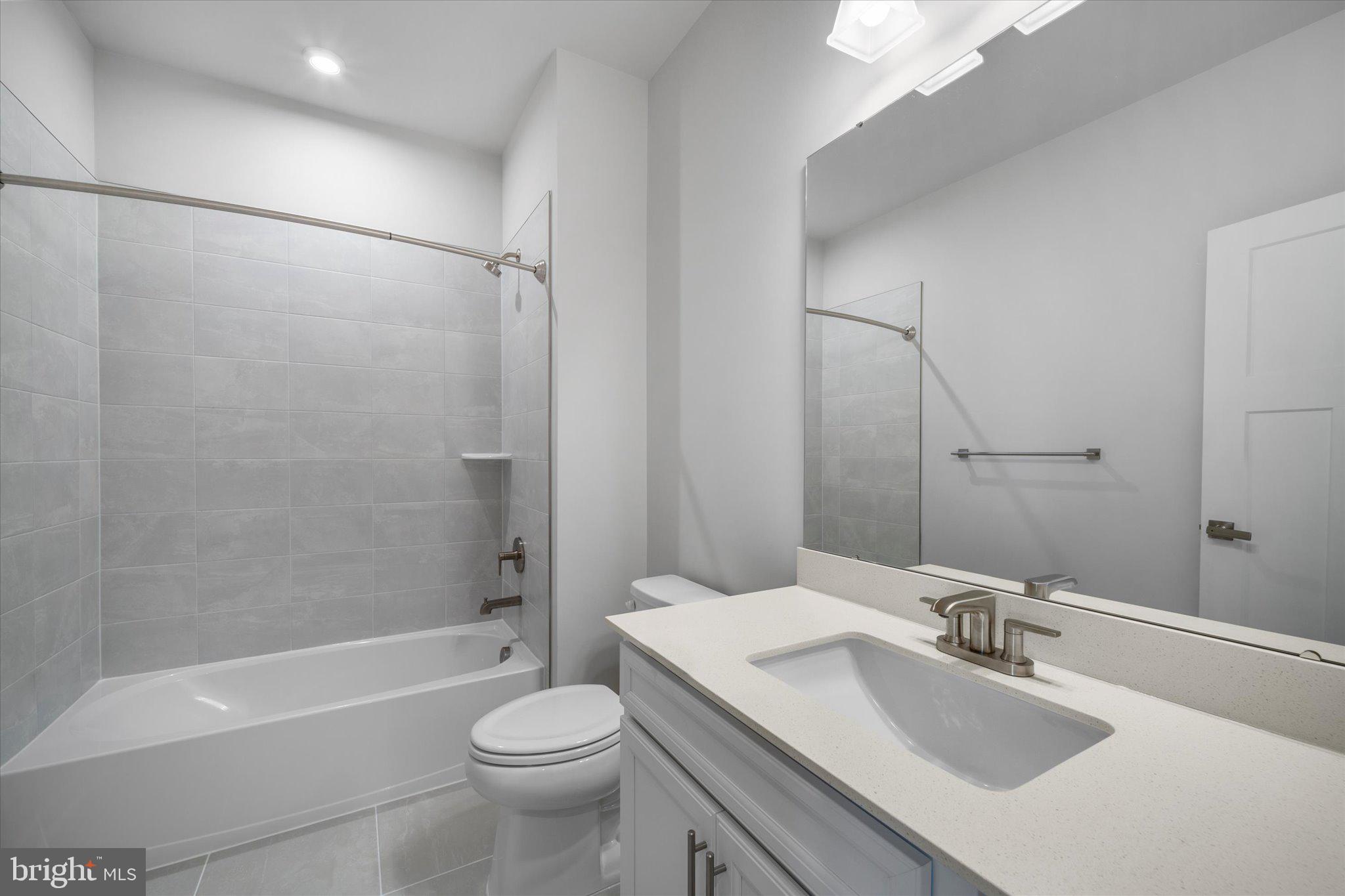 42530 Invergordon Terrace Sterling, VA 20166 - Photo 30 of 39 a bathroom with a sink toilet tub and shower