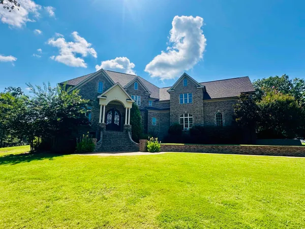 a view of a house with a swimming pool